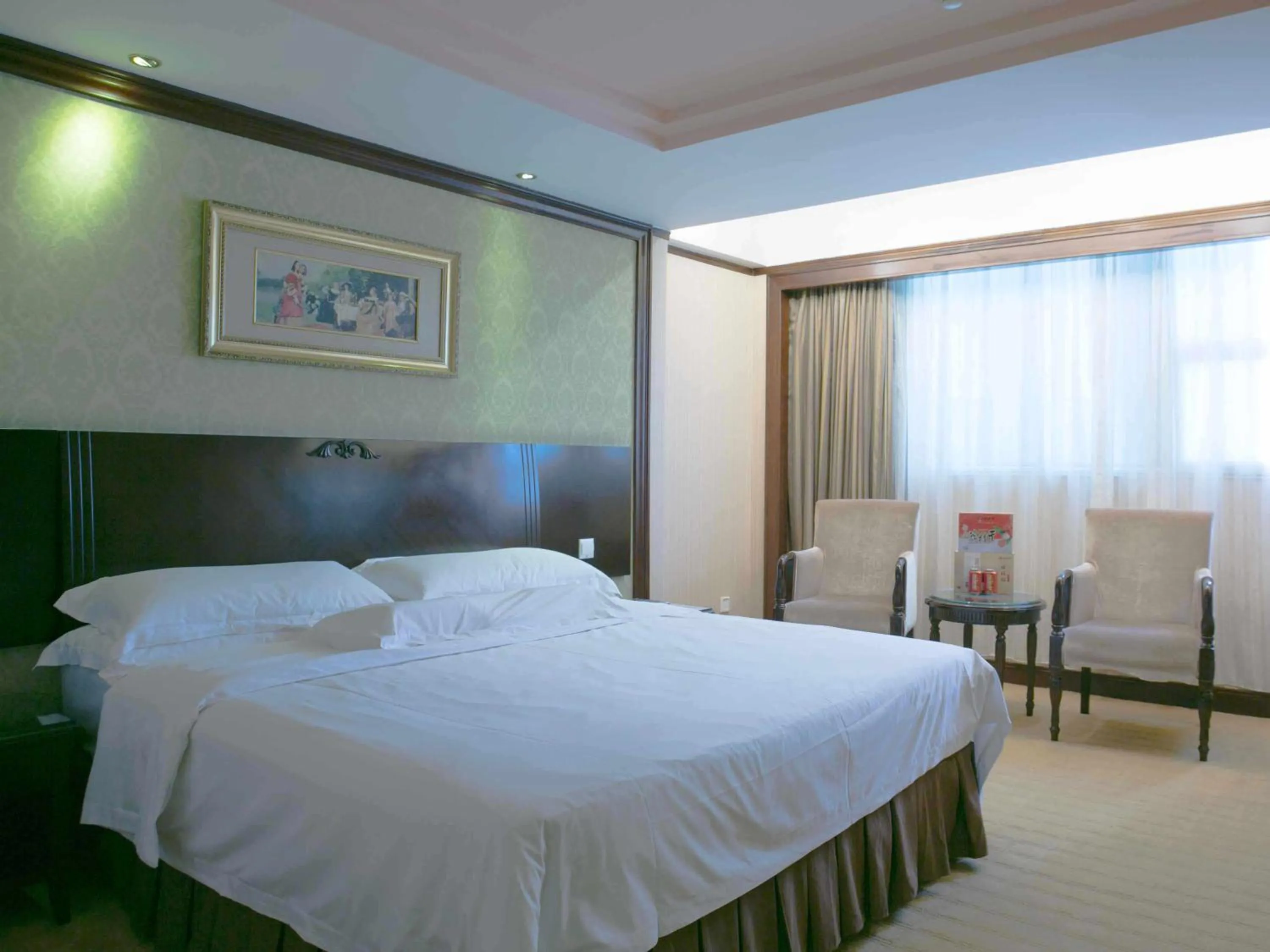 Bed in Vienna Hotel Shenzhen Fuhua Road