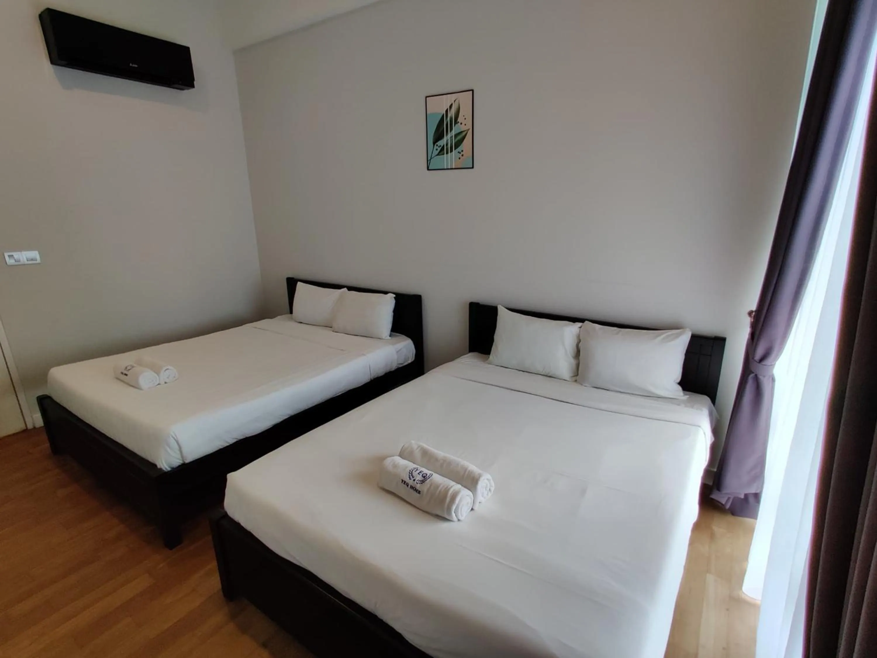 Bed in Leo Guesthouse at Anggun Residence Suite