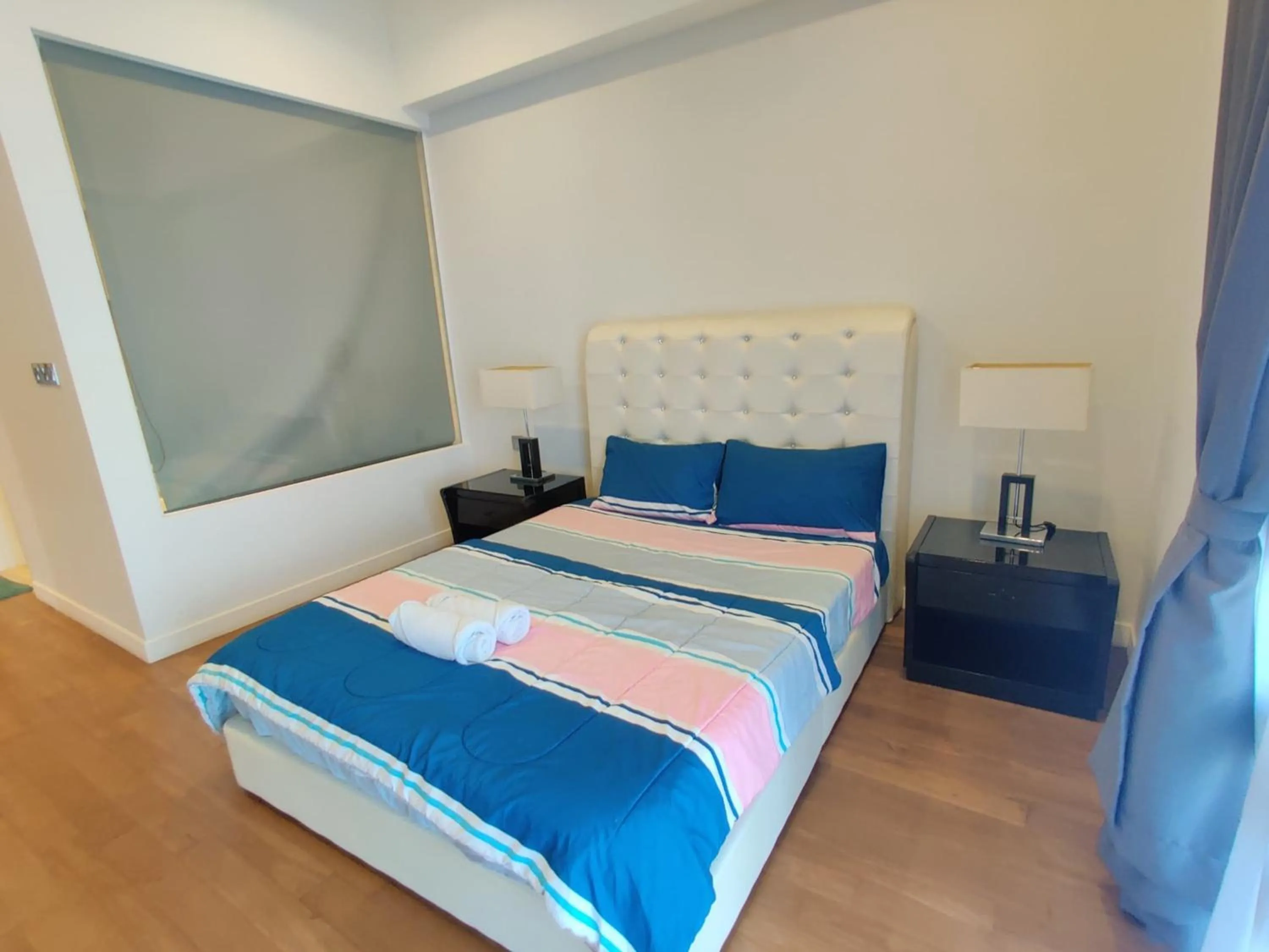 Bed in Leo Guesthouse at Anggun Residence Suite