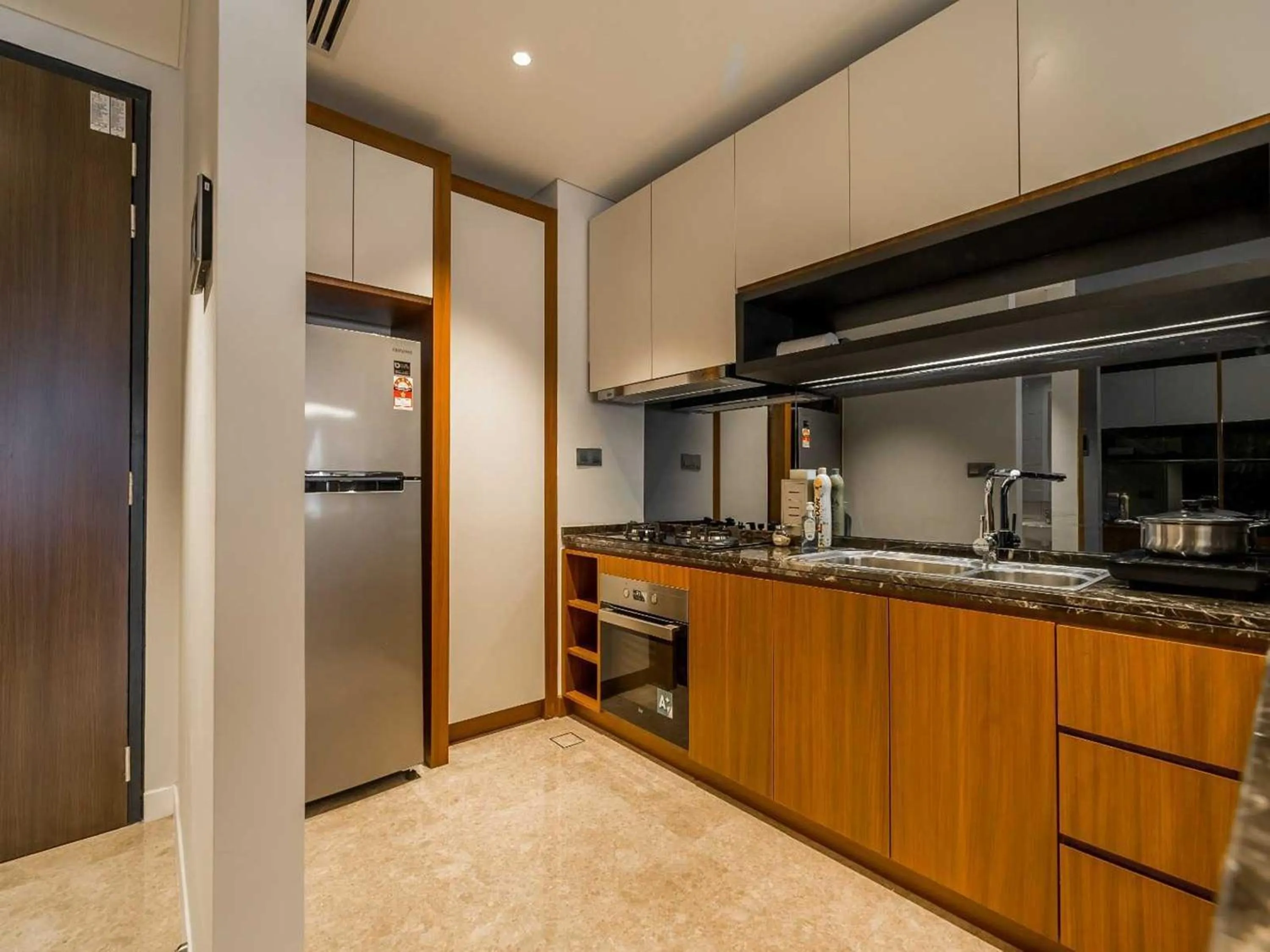 Kitchen or kitchenette in Leo Guesthouse at Anggun Residence Suite