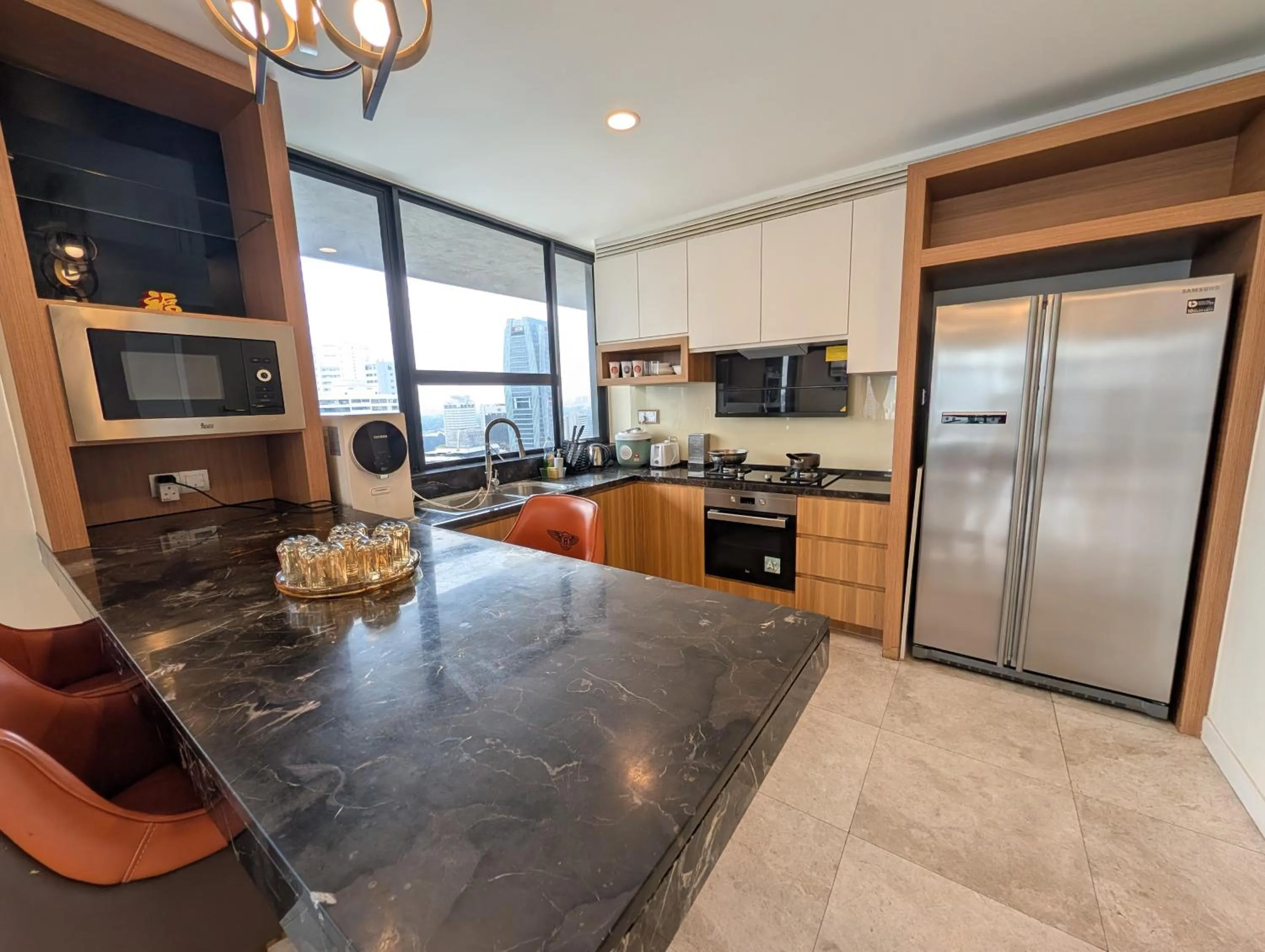 Kitchen or kitchenette in Leo Guesthouse at Anggun Residence Suite