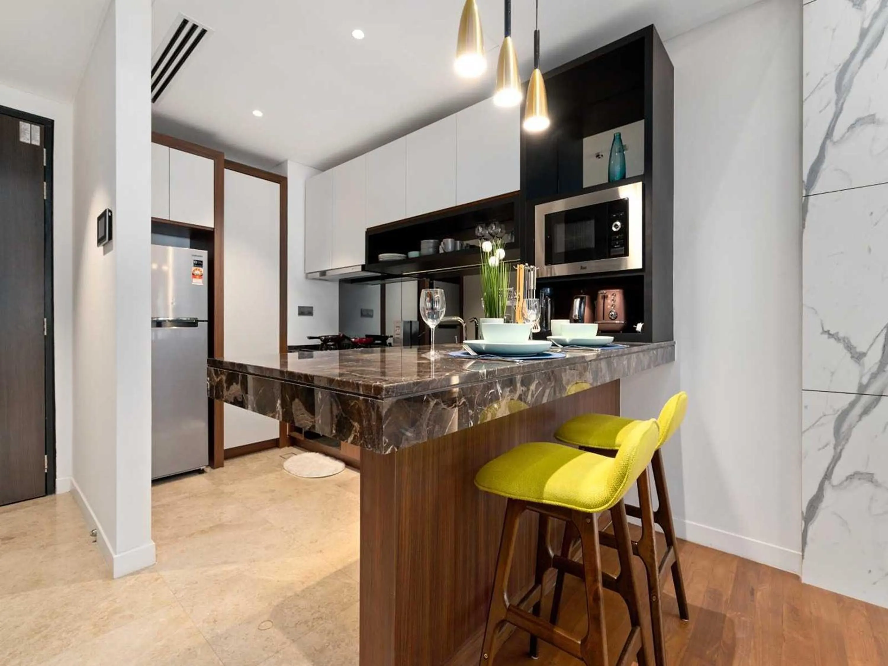 Kitchen or kitchenette in Leo Guesthouse at Anggun Residence Suite