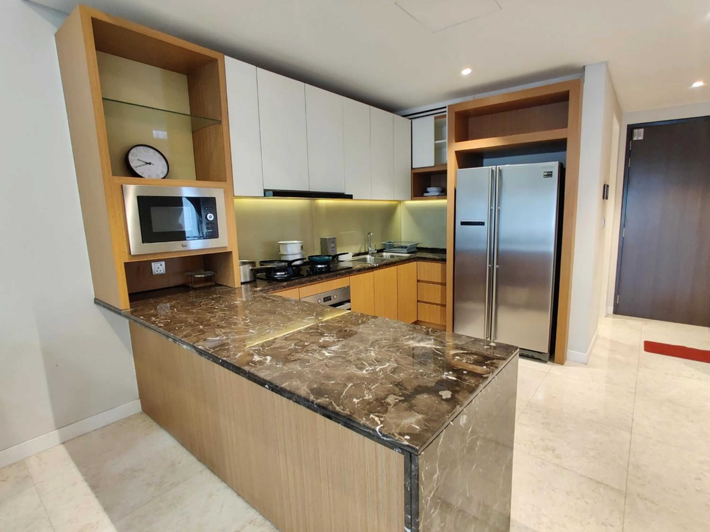 Kitchen or kitchenette in Leo Guesthouse at Anggun Residence Suite