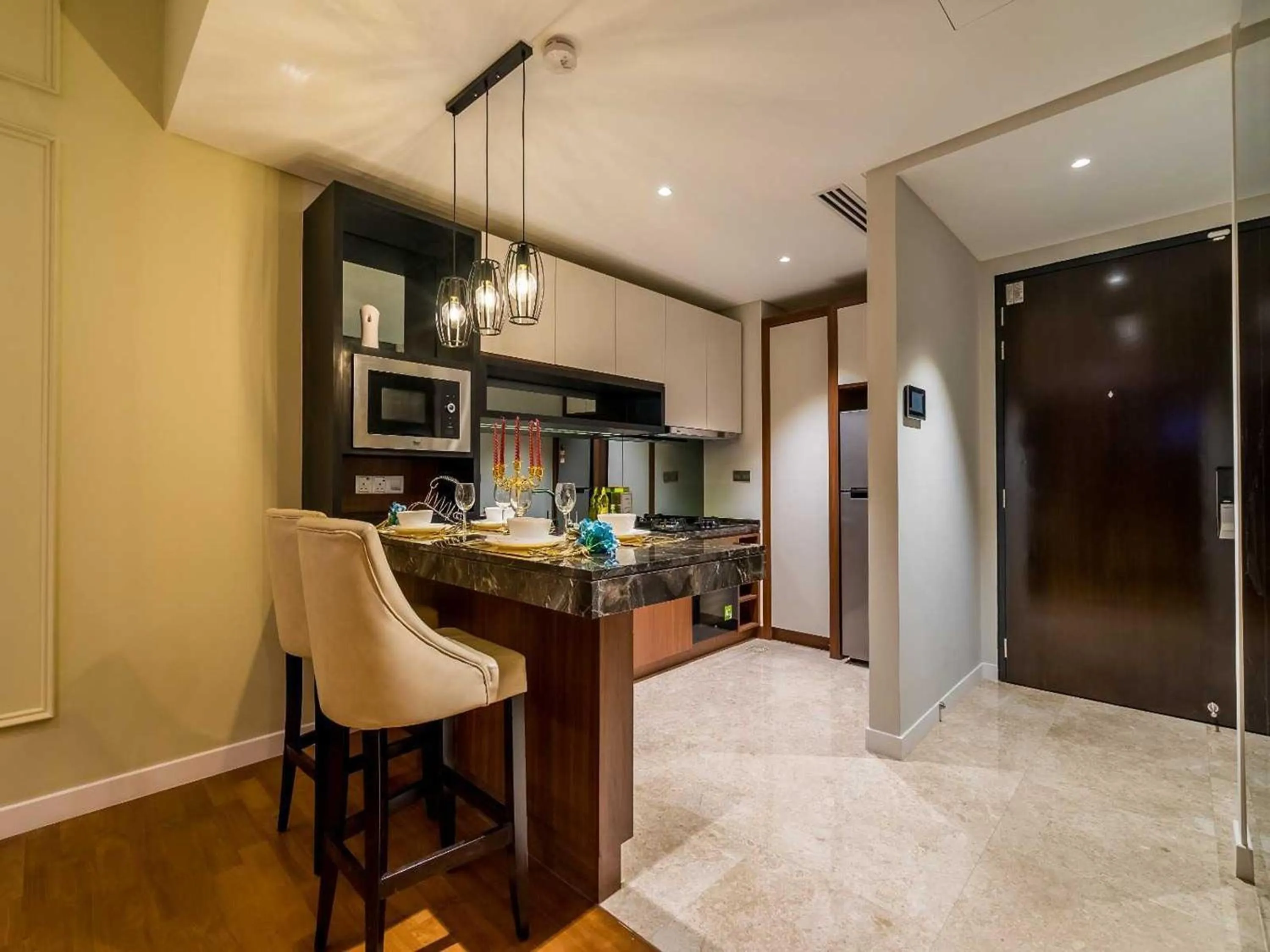 Kitchen or kitchenette in Leo Guesthouse at Anggun Residence Suite