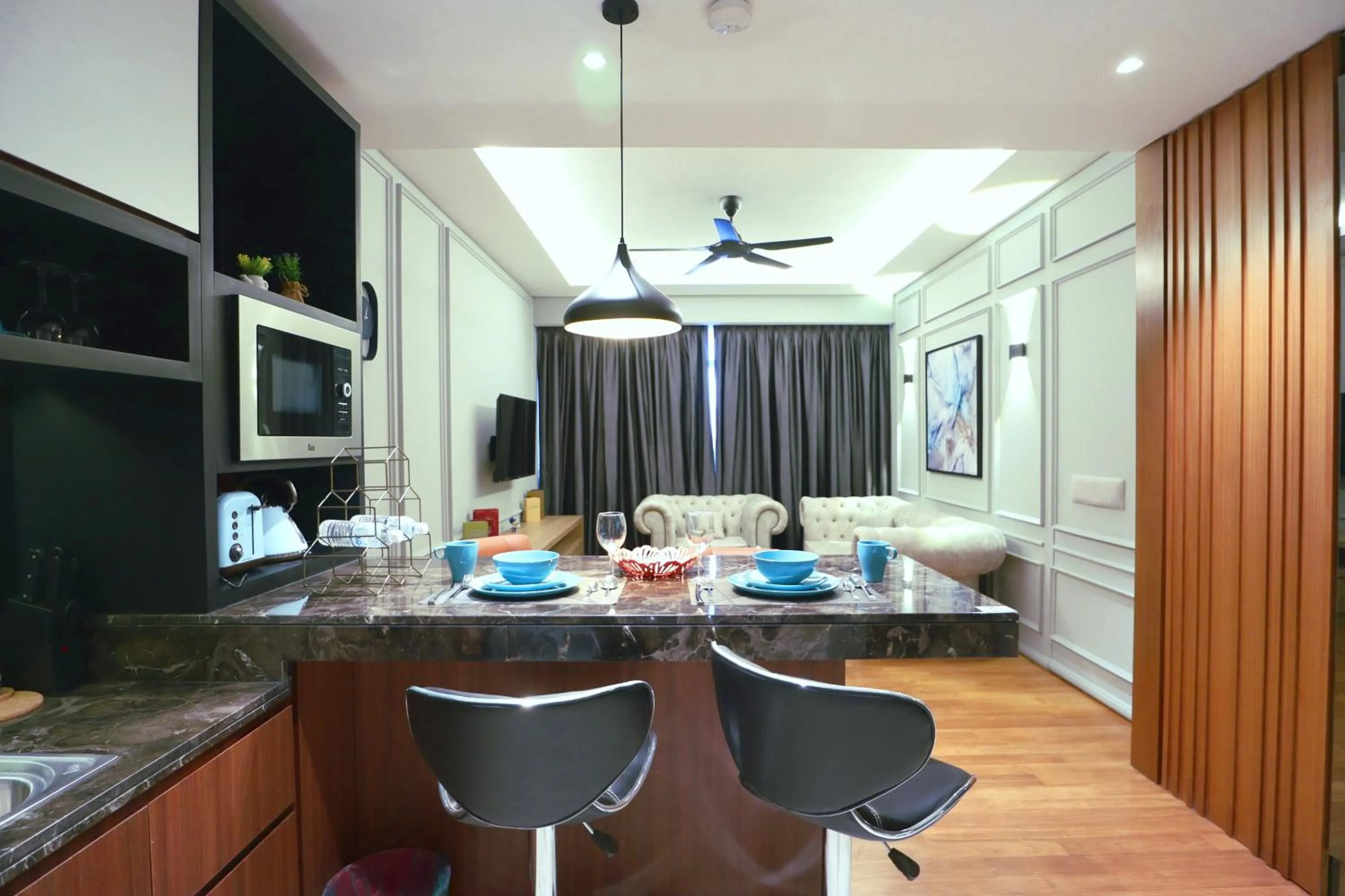 Kitchen or kitchenette in Leo Guesthouse at Anggun Residence Suite