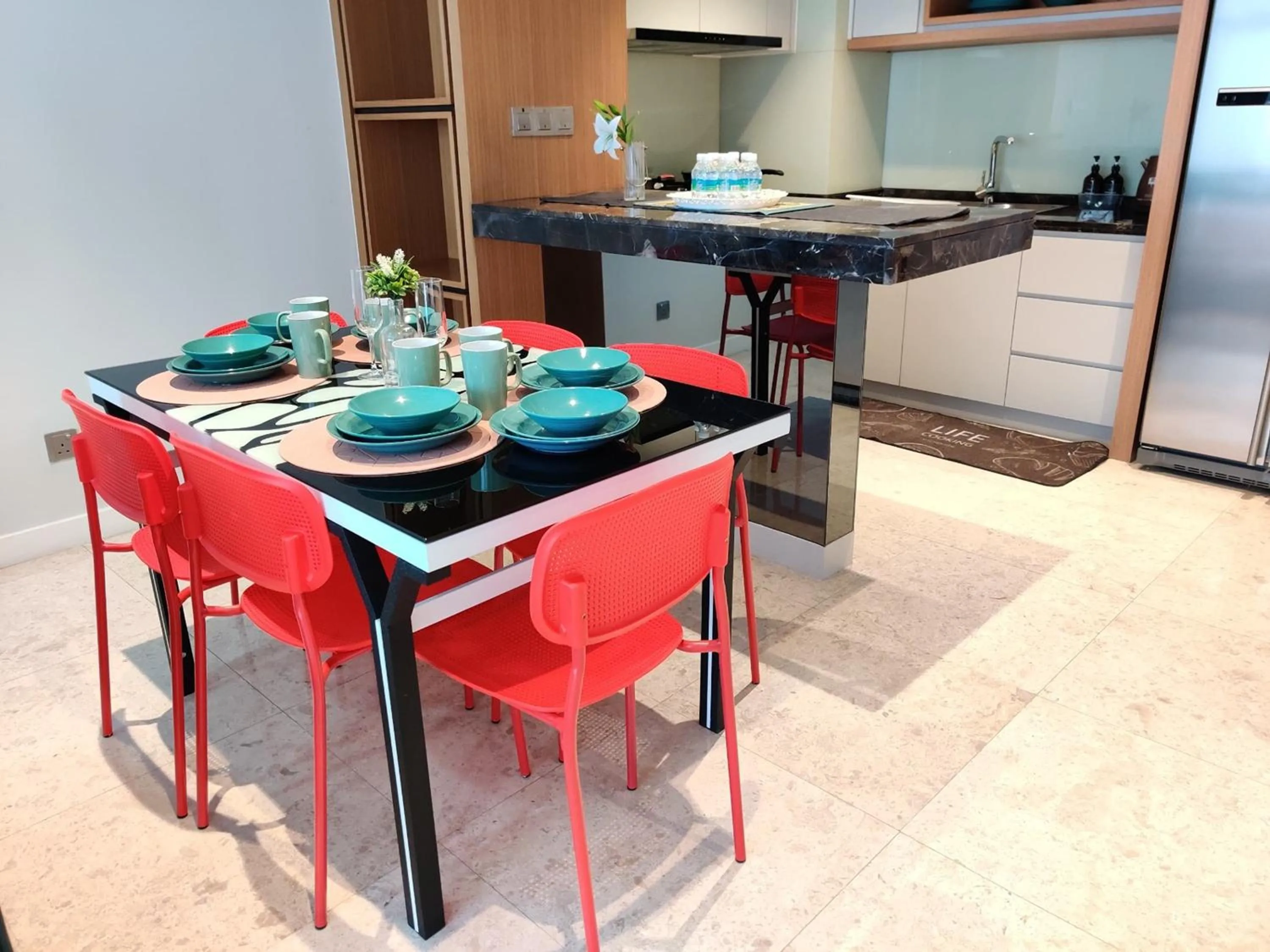 Kitchen or kitchenette in Leo Guesthouse at Anggun Residence Suite