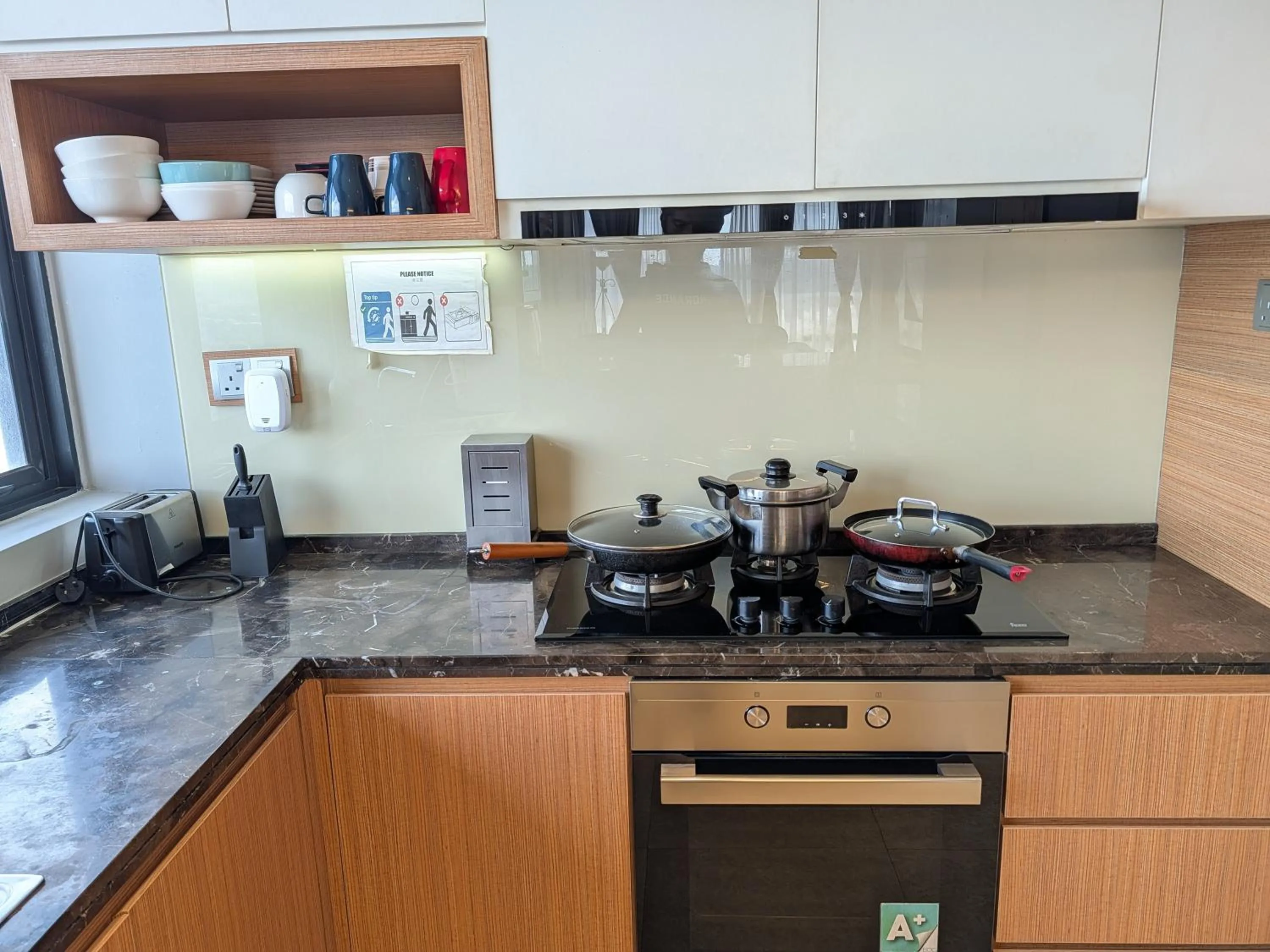 Kitchen or kitchenette in Leo Guesthouse at Anggun Residence Suite