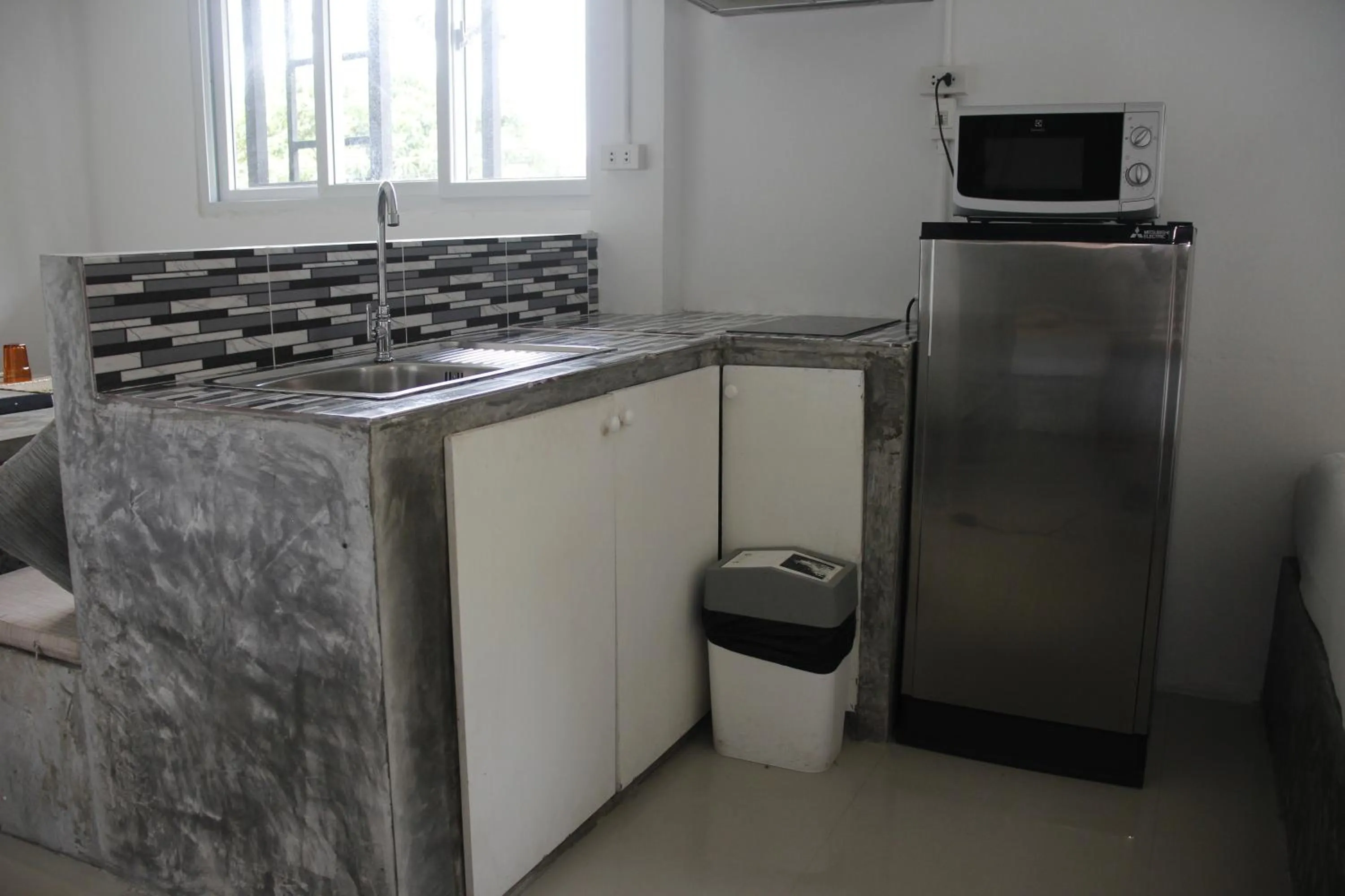 Kitchen or kitchenette in Samui Beach Residence Hotel