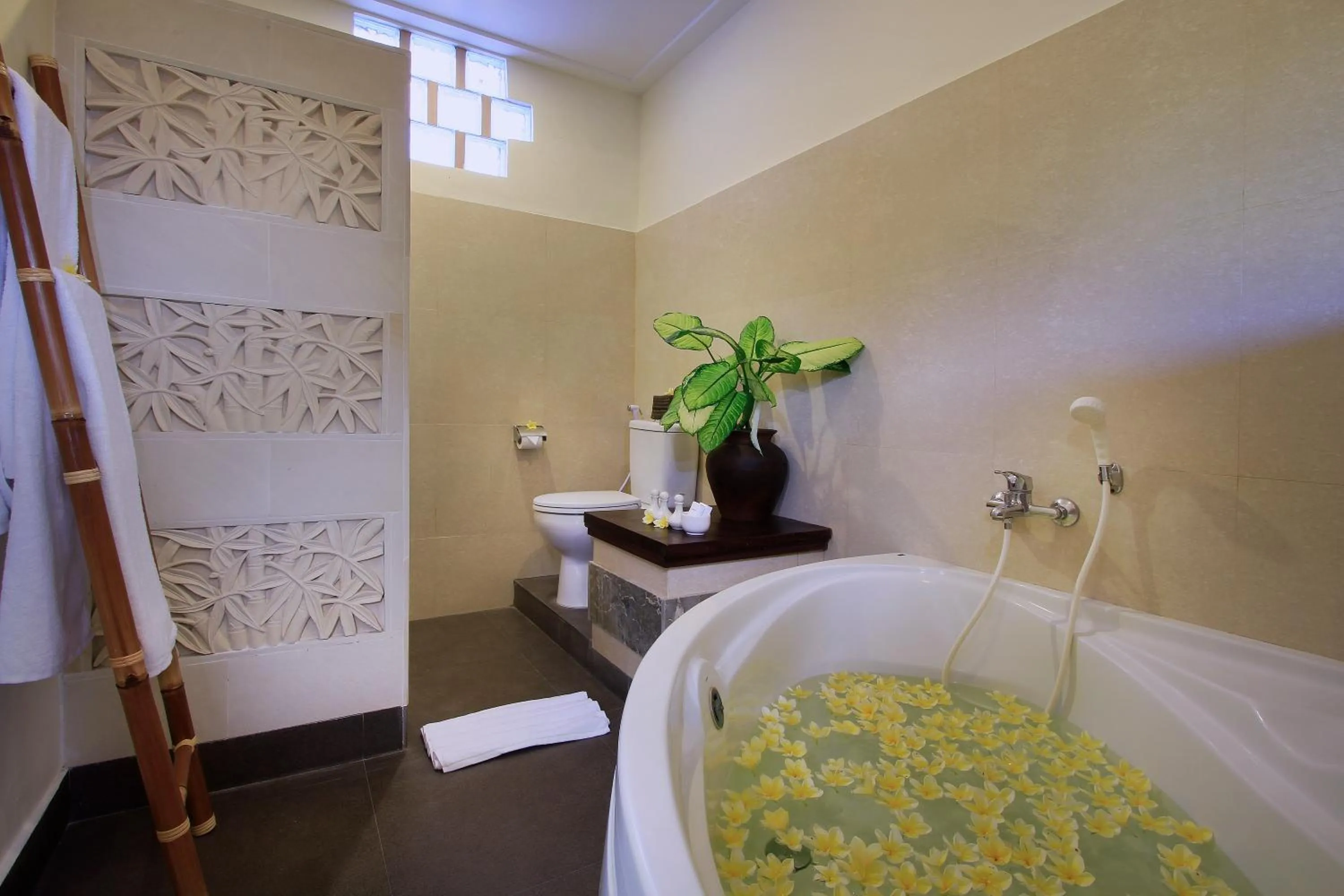 Bathroom in Nang Ade Villa by GenuineHost