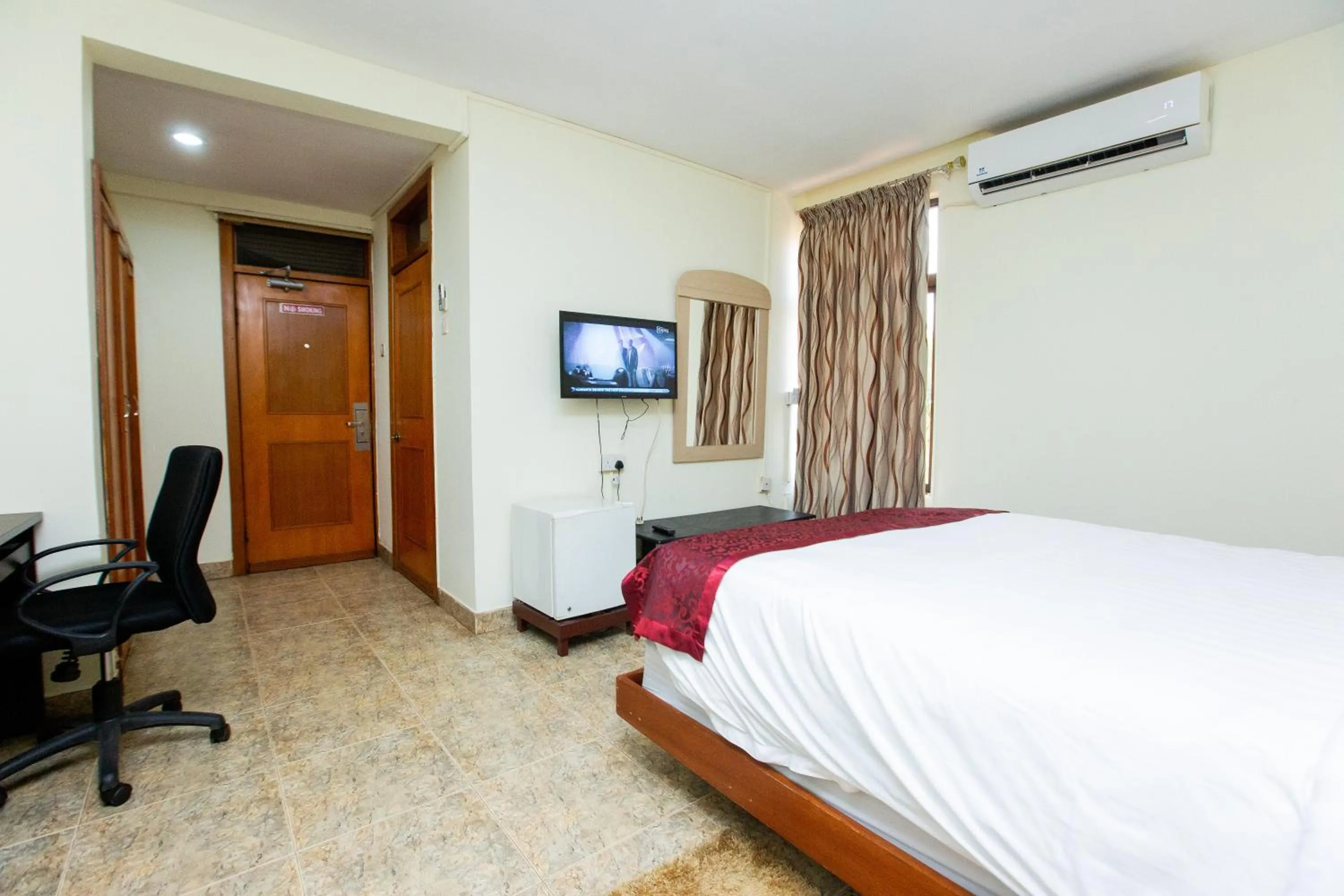 Bed in Sam's Cottage Hotel