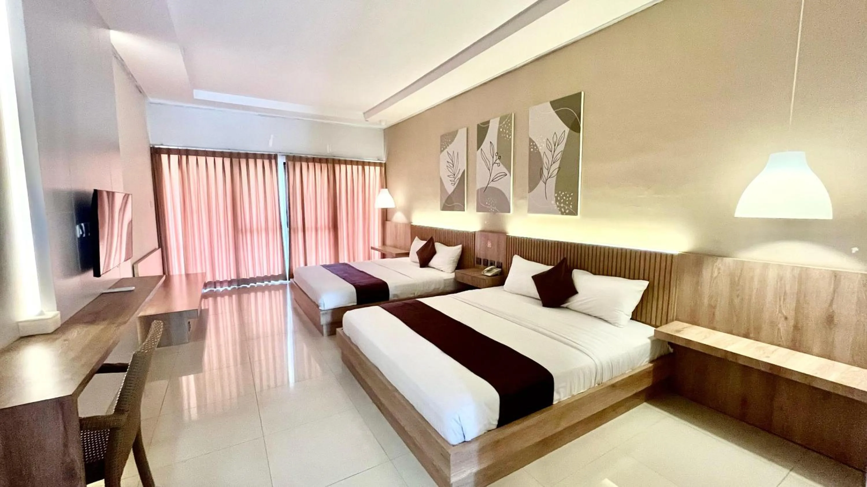 Bed in Surya Kencana Seaside Hotel