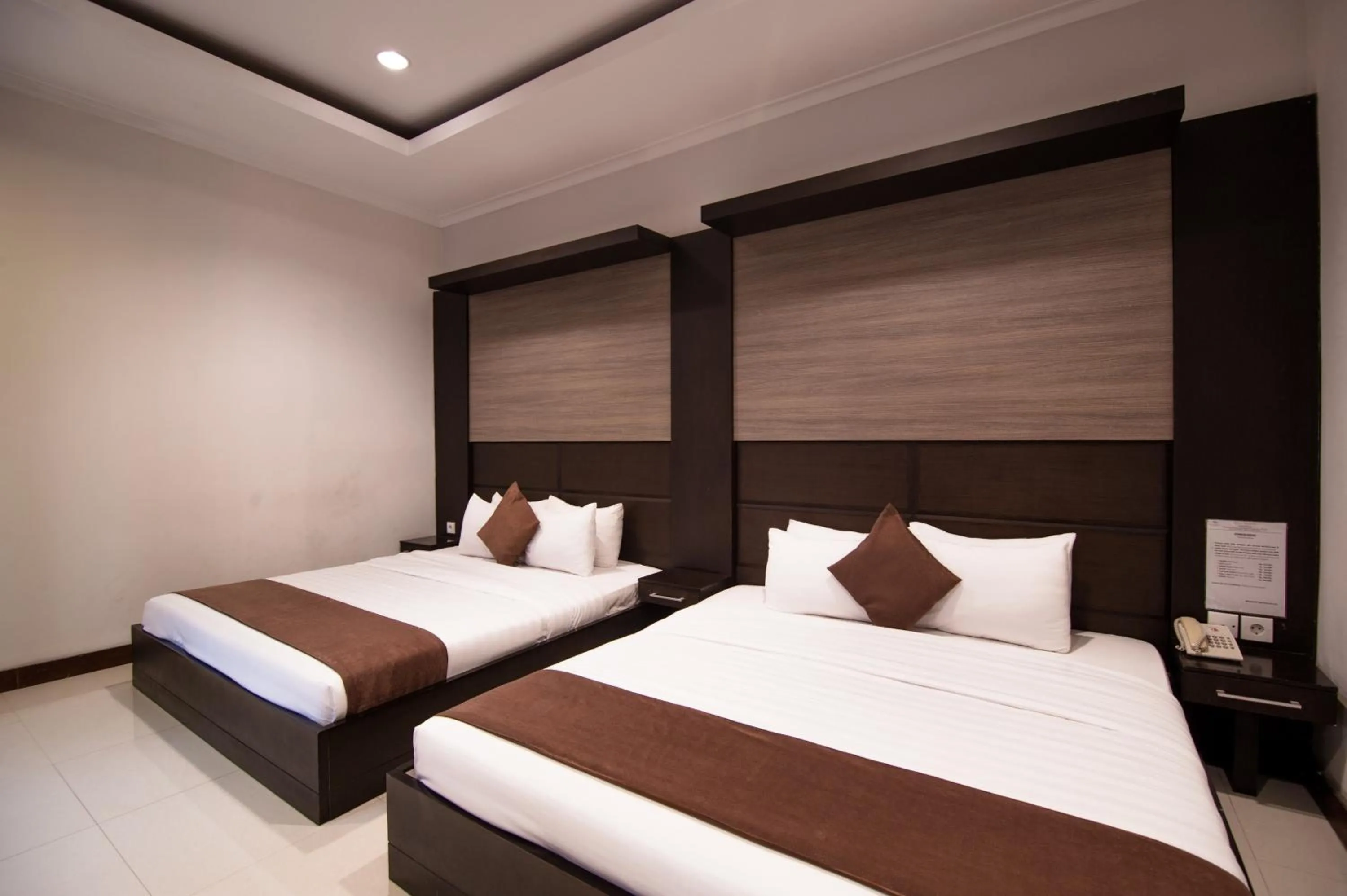 Bed in Surya Kencana Seaside Hotel