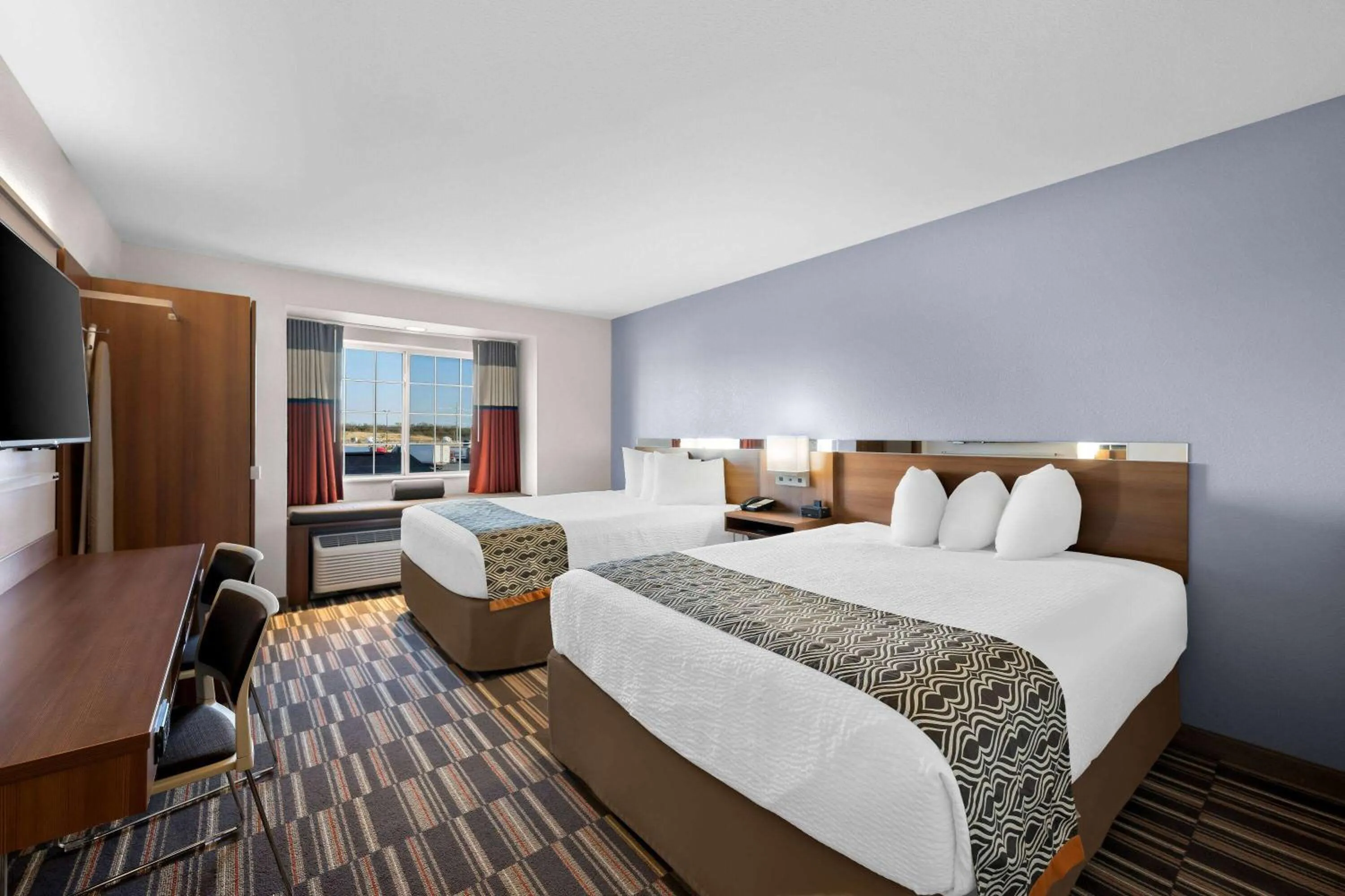 Bed in Microtel Inn & Suites by Wyndham Sweetwater