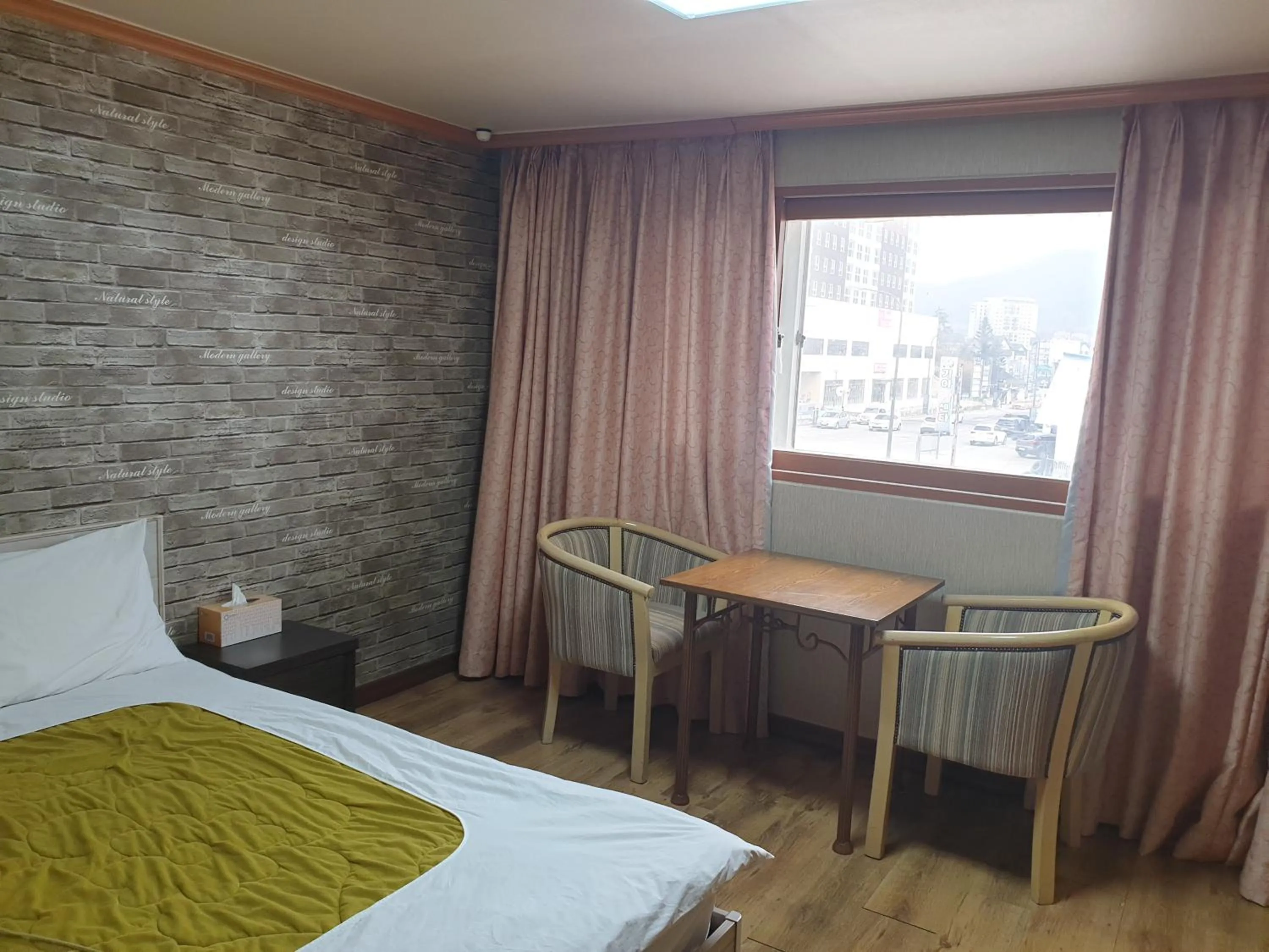 Bed in Green and Blue Hotel