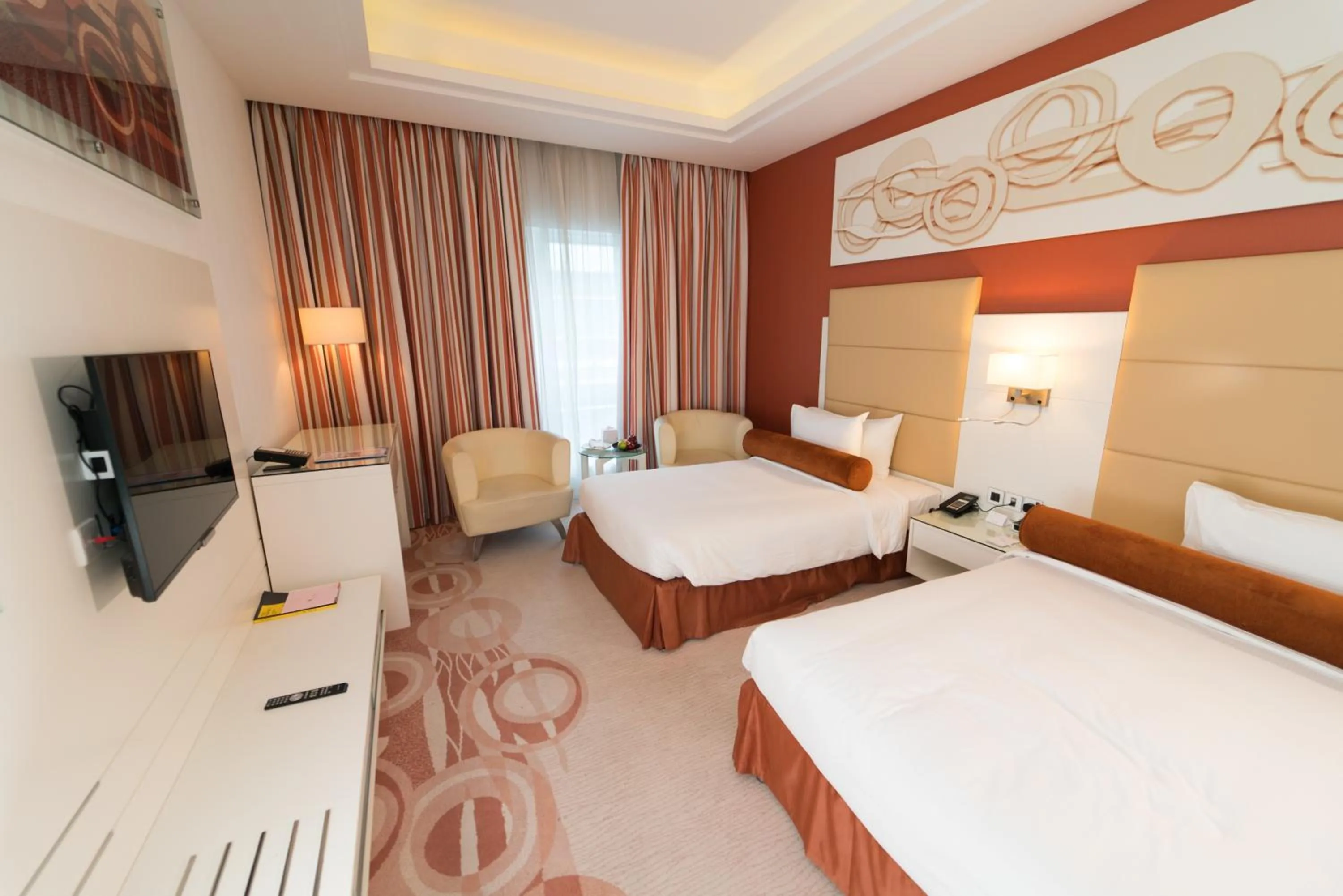 Photo of the whole room in Golden Tulip Downtown Abu Dhabi