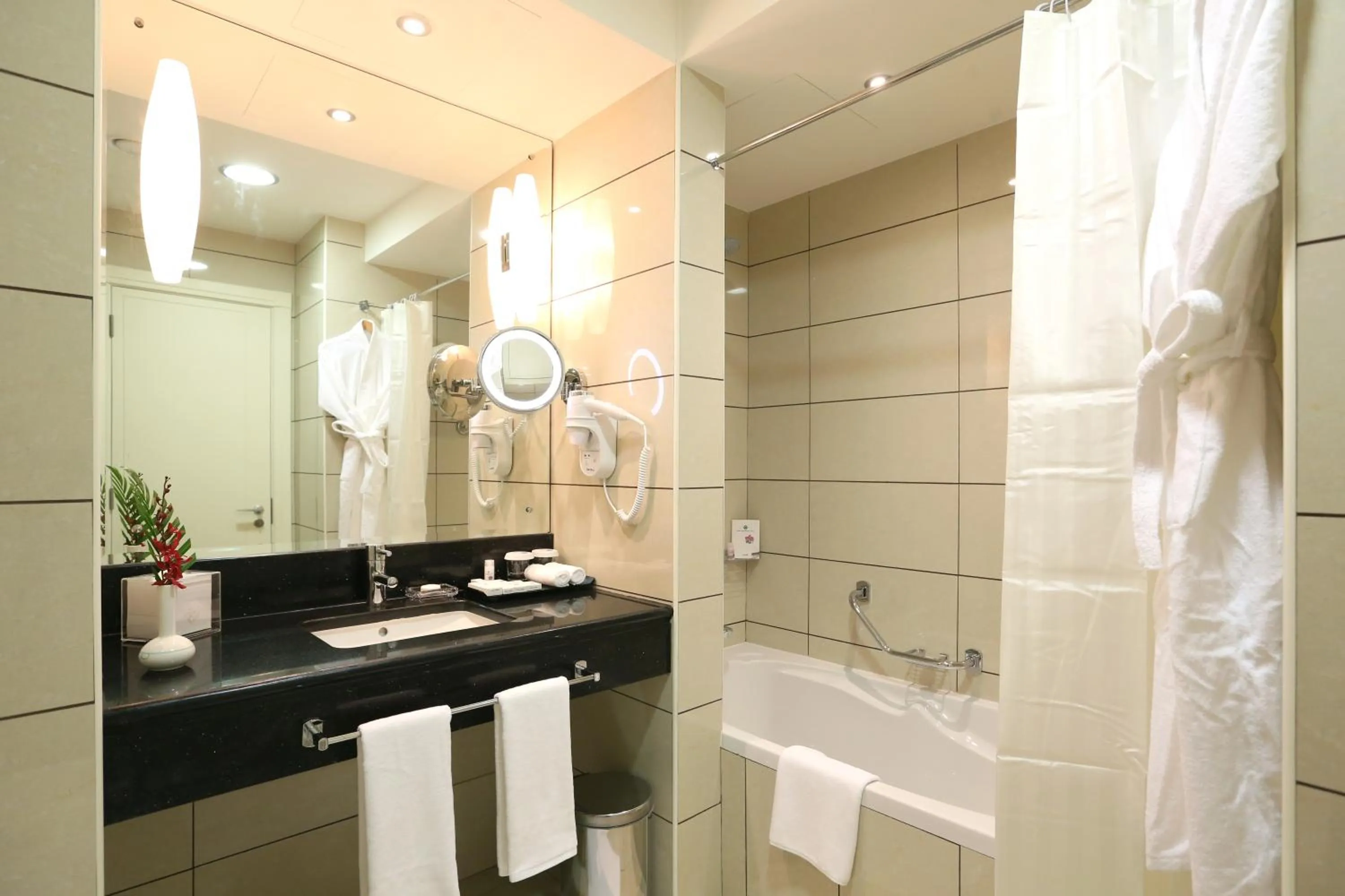 Bathroom in Golden Tulip Downtown Abu Dhabi