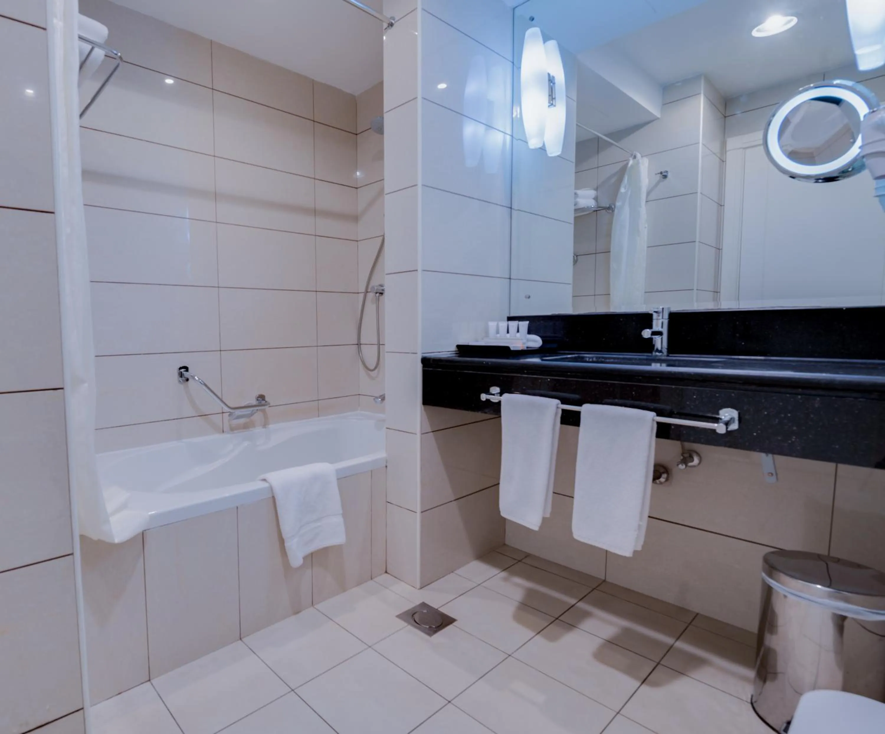 Bathroom in Golden Tulip Downtown Abu Dhabi