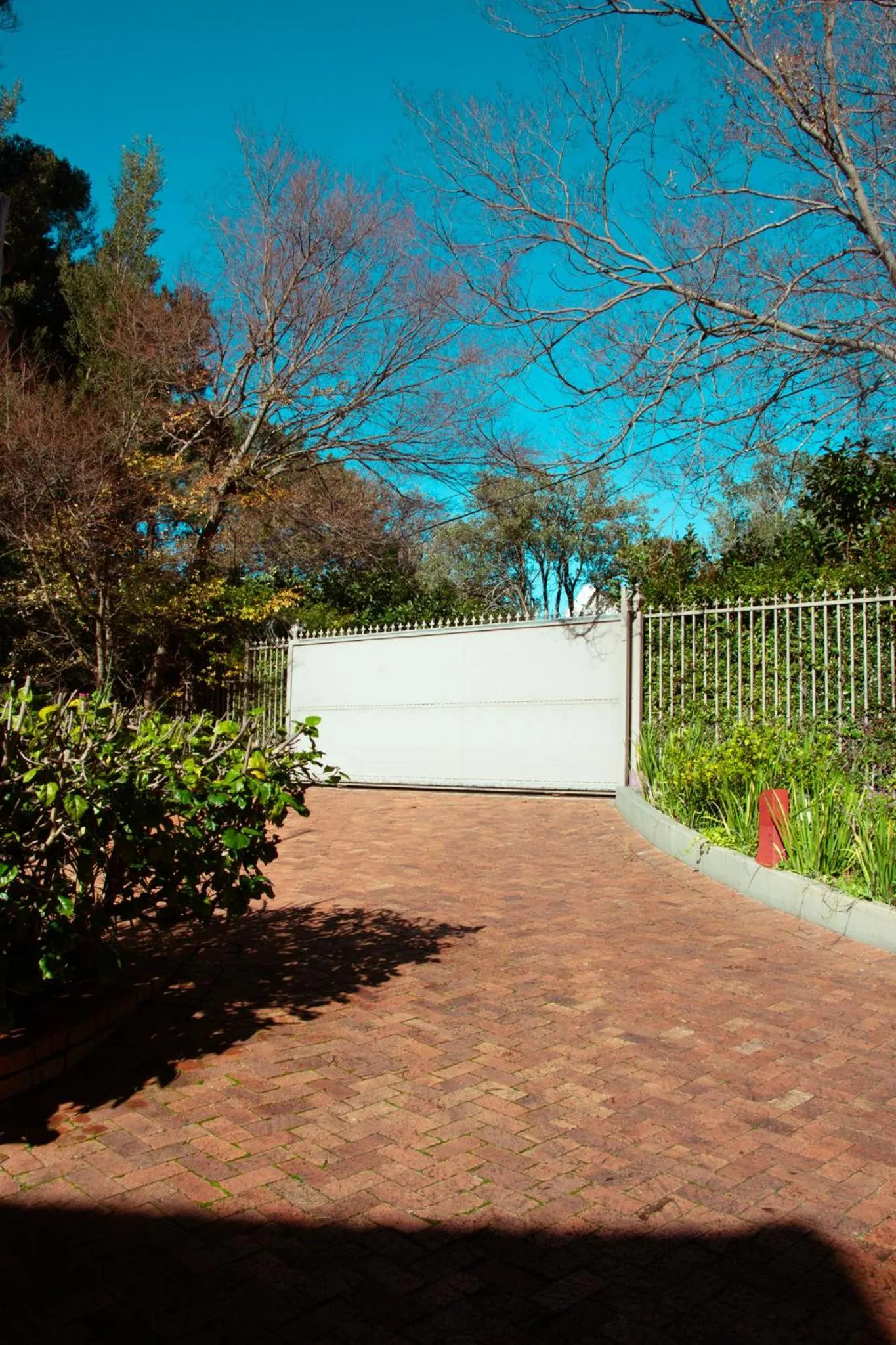 Facade/entrance in Southern Light Country House