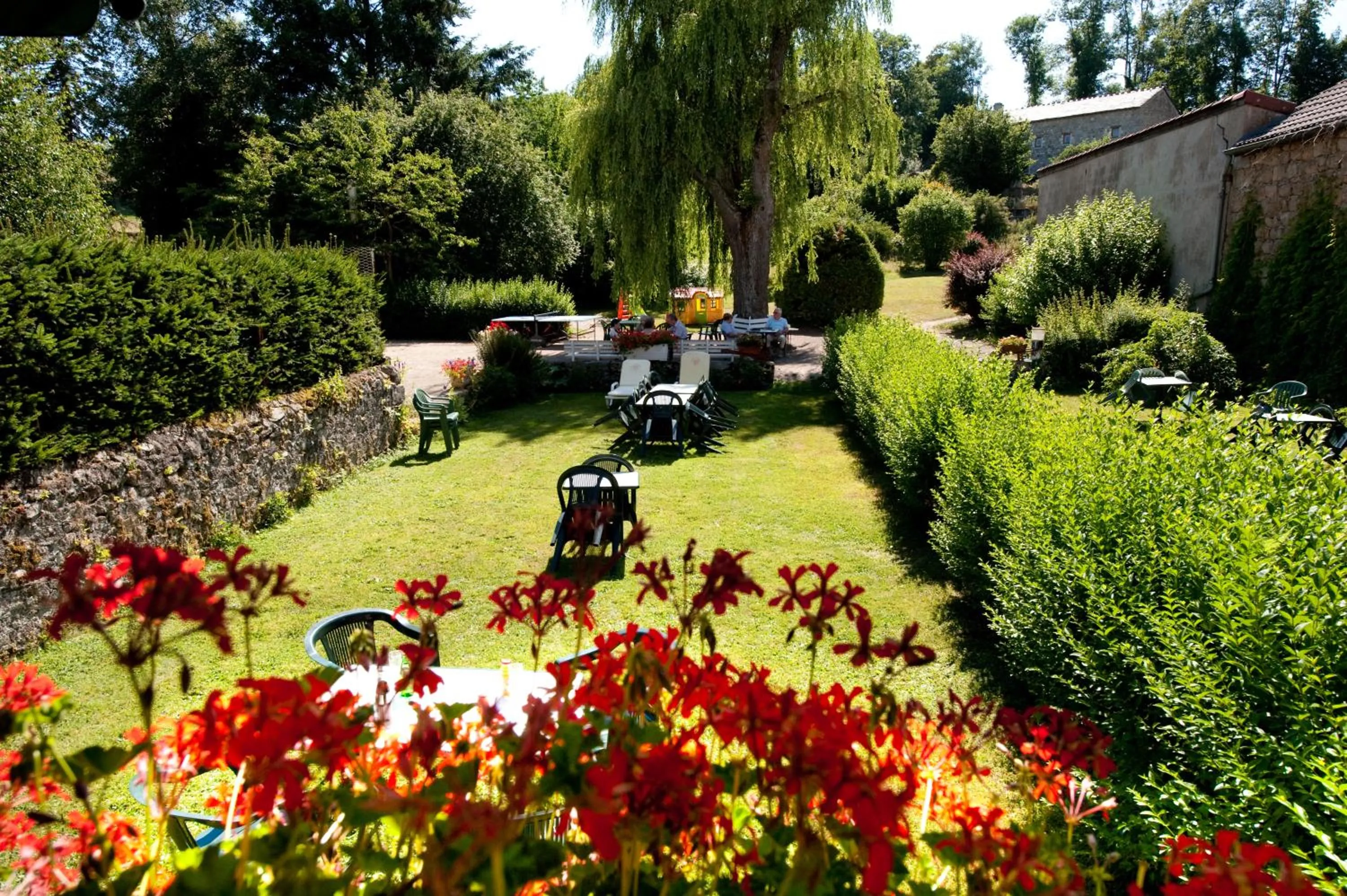 Garden view in Logis SPA Hotel Restaurant De La Poste
