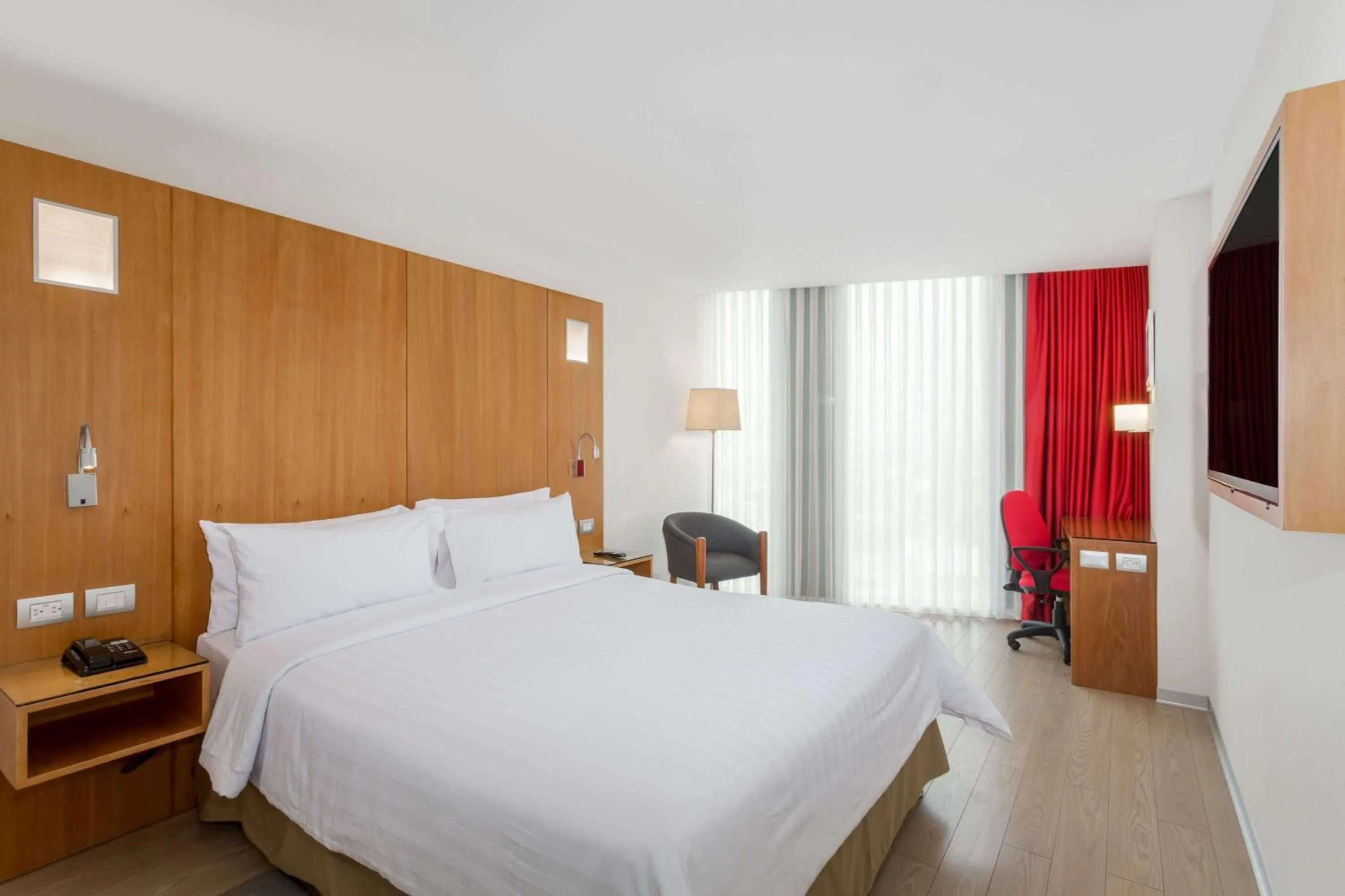 Photo of the whole room, Bed in Ramada Encore by Wyndham Lima San Isidro