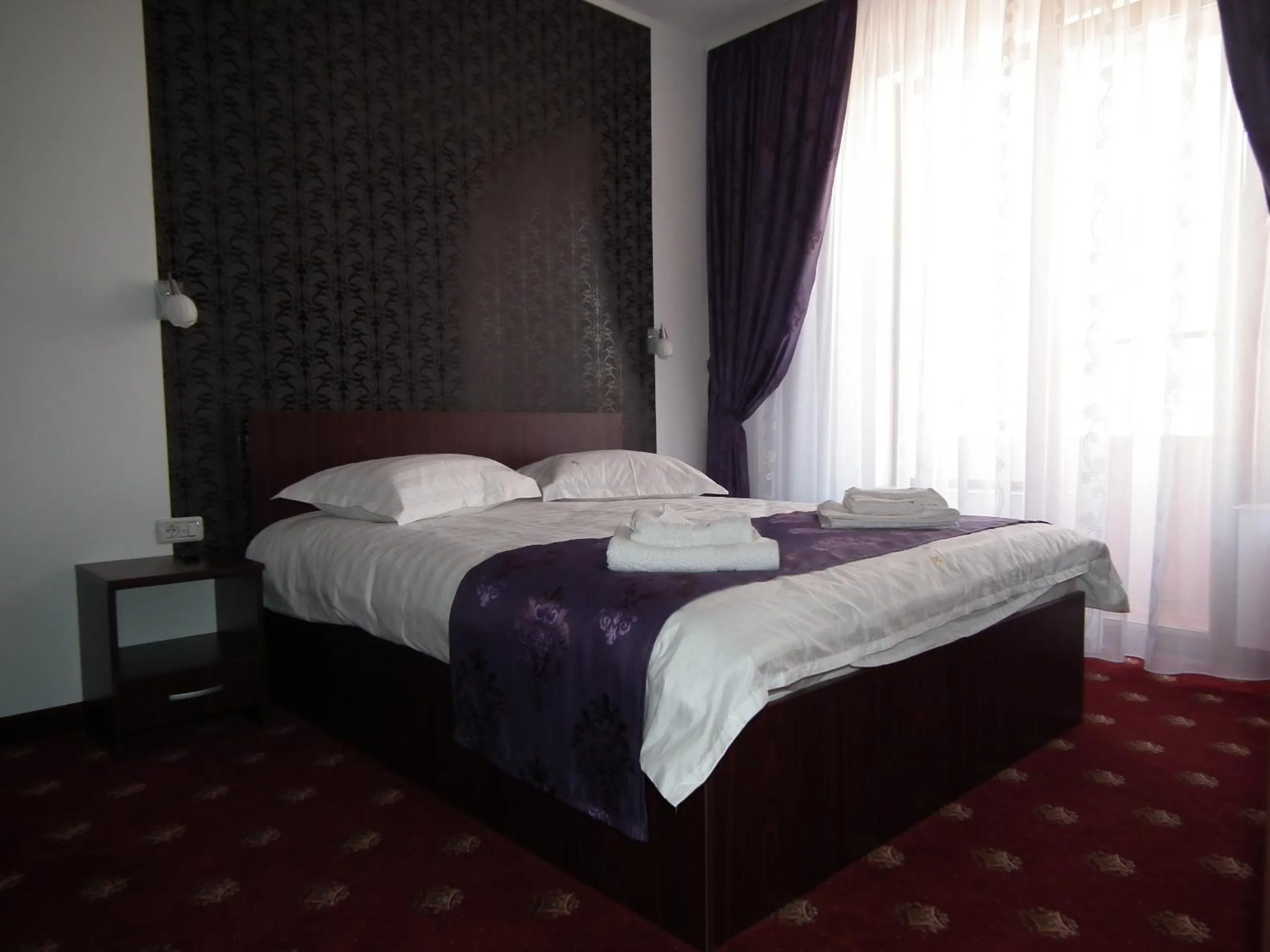 Bed in Vila Queen Mary