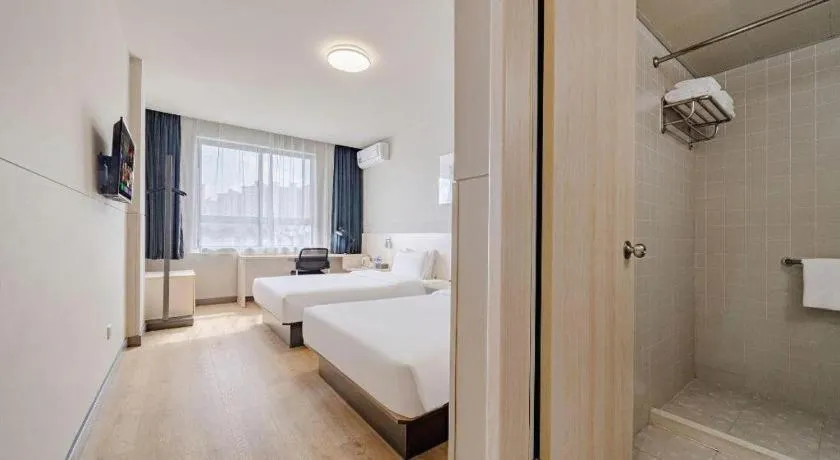 Bed in Jinjiang Inn Shanghai International Tourism and Resorts Zone Kangxin Highway Branch