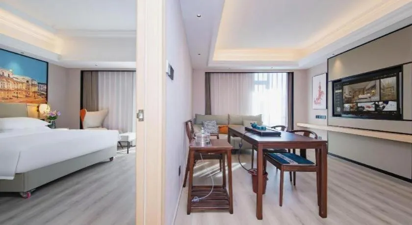 Bed in Vienna International Hotel Wuhan Huanghelou Pengliuyang Metro Station