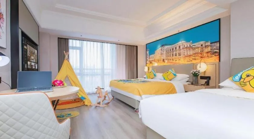 Bed in Vienna International Hotel Wuhan Huanghelou Pengliuyang Metro Station