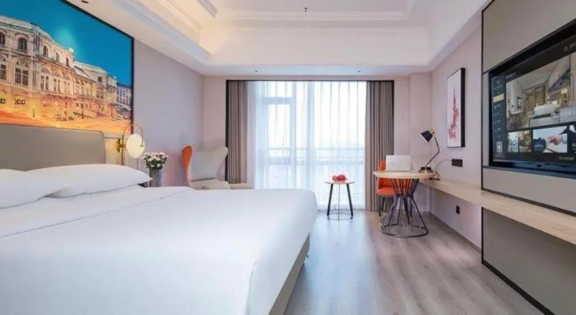 Bed in Vienna International Hotel Wuhan Huanghelou Pengliuyang Metro Station