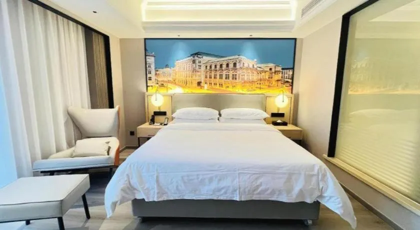 Bed in Vienna International Hotel Wuhan Huanghelou Pengliuyang Metro Station