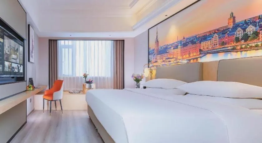 Bed in Vienna International Hotel Wuhan Huanghelou Pengliuyang Metro Station