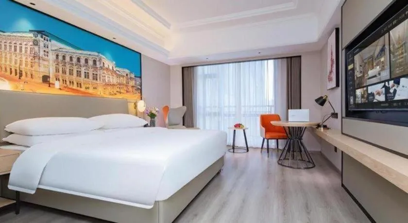 Bed in Vienna International Hotel Wuhan Huanghelou Pengliuyang Metro Station