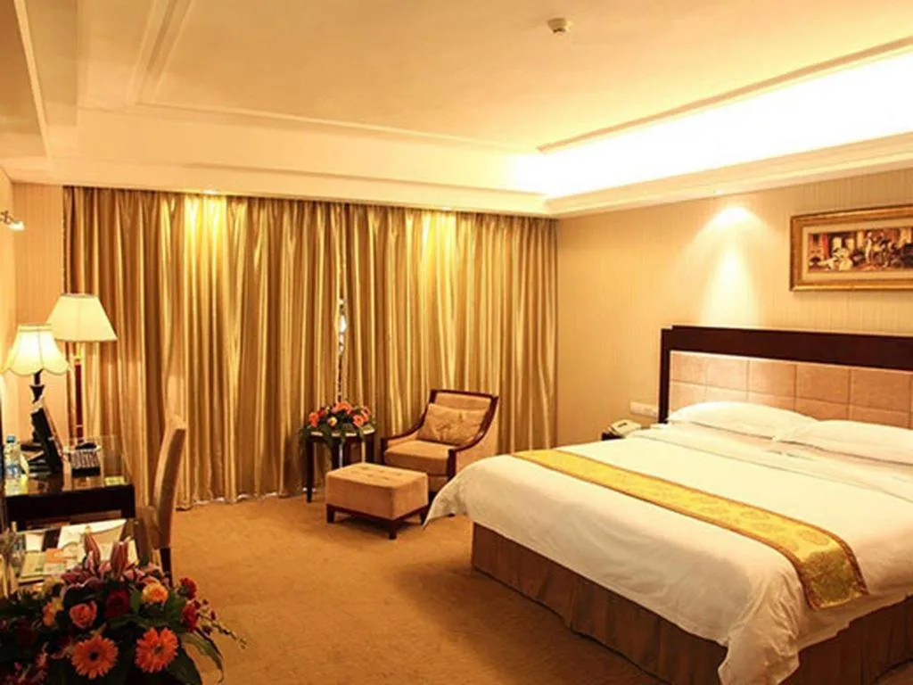 Bed in Vienna International Hotel Wuhan Huanghelou Pengliuyang Metro Station