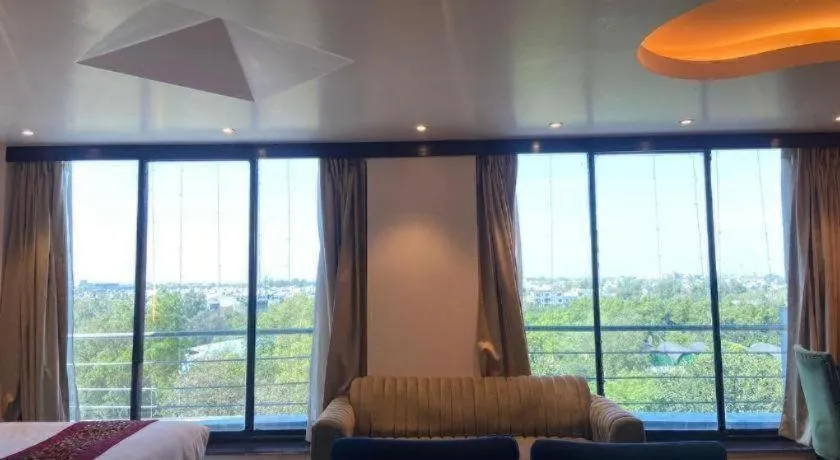 Bed in Hotel Signature Grand