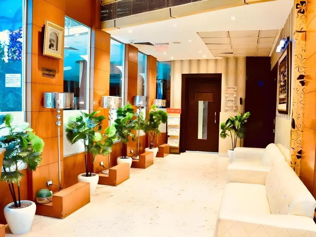 Bed in Hotel Signature Grand