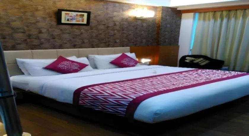 Bed in Hotel Signature Grand