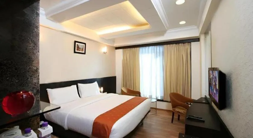 Bed in Hotel Signature Grand