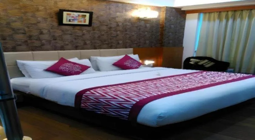 Bed in Hotel Signature Grand