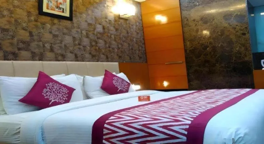 Bed in Hotel Signature Grand