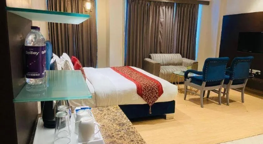 Bed in Hotel Signature Grand