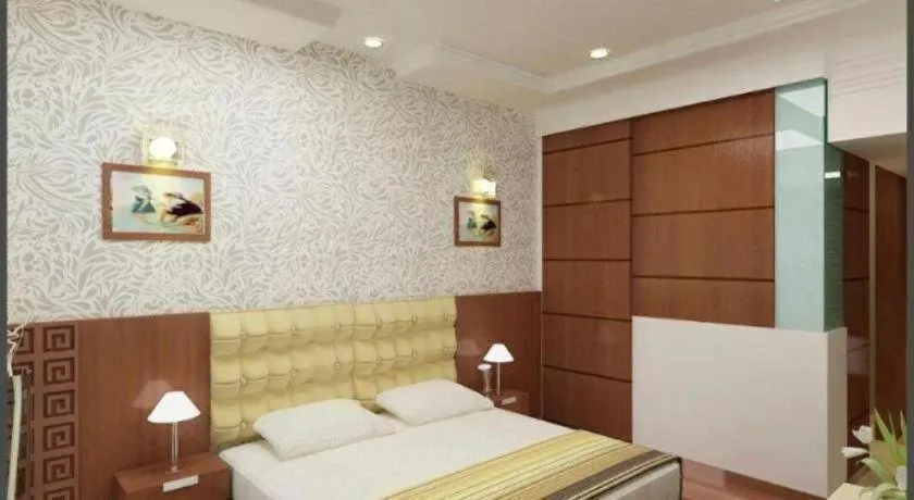 Bed in Hotel Signature Grand