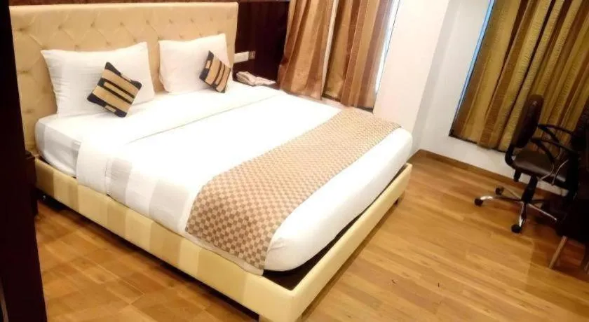 Bed in Hotel Signature Grand