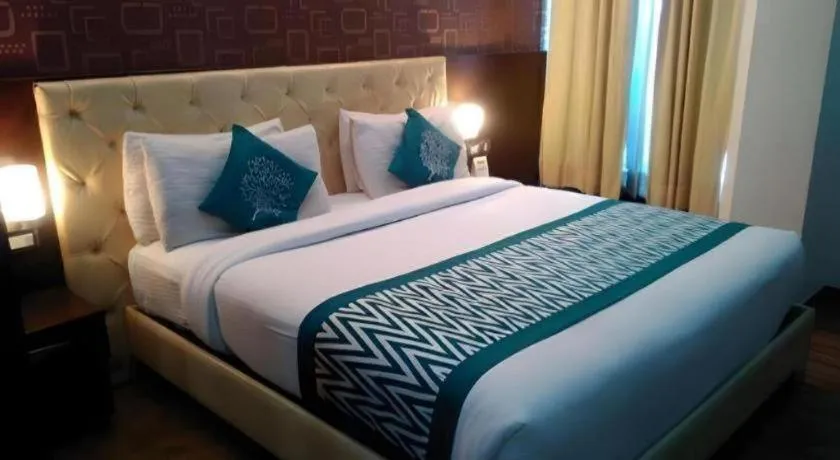 Bed in Hotel Signature Grand