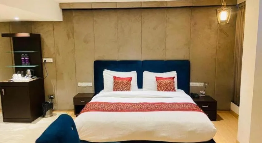 Bed in Hotel Signature Grand