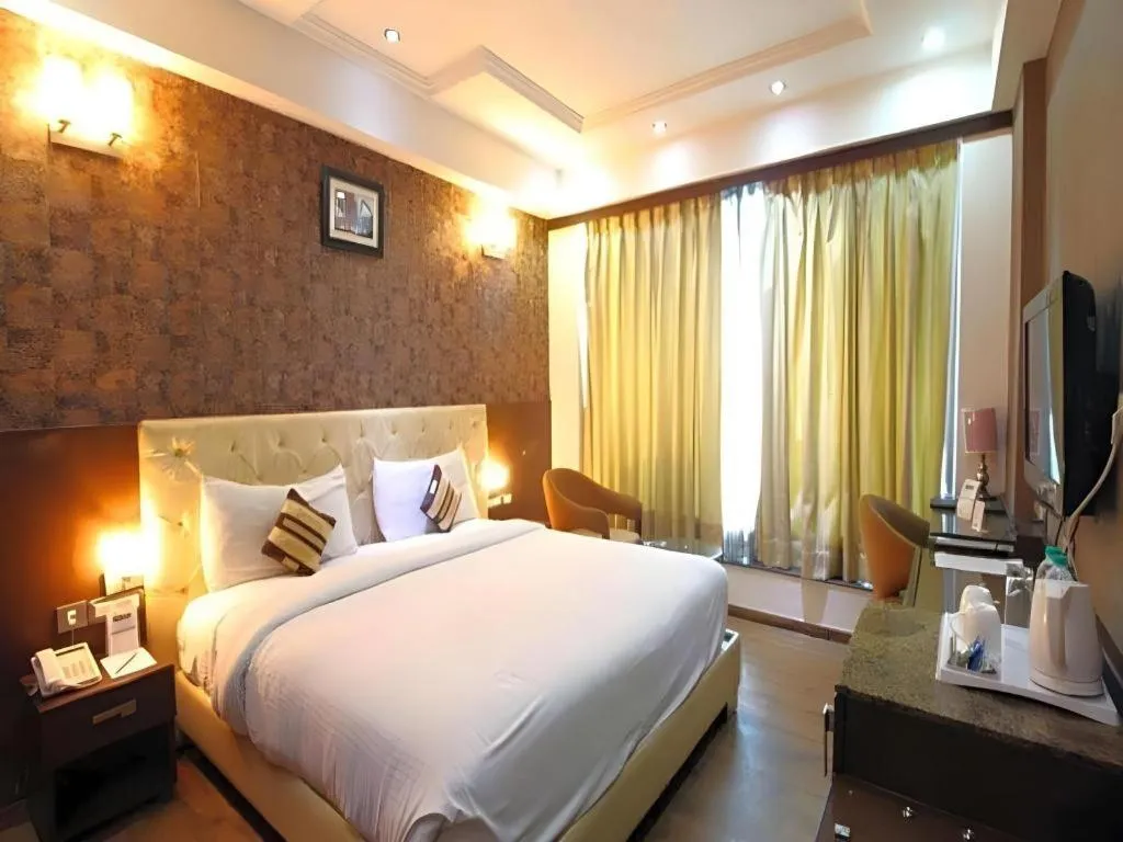 Bed in Hotel Signature Grand