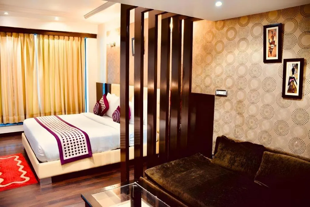 Bed in Hotel Signature Grand