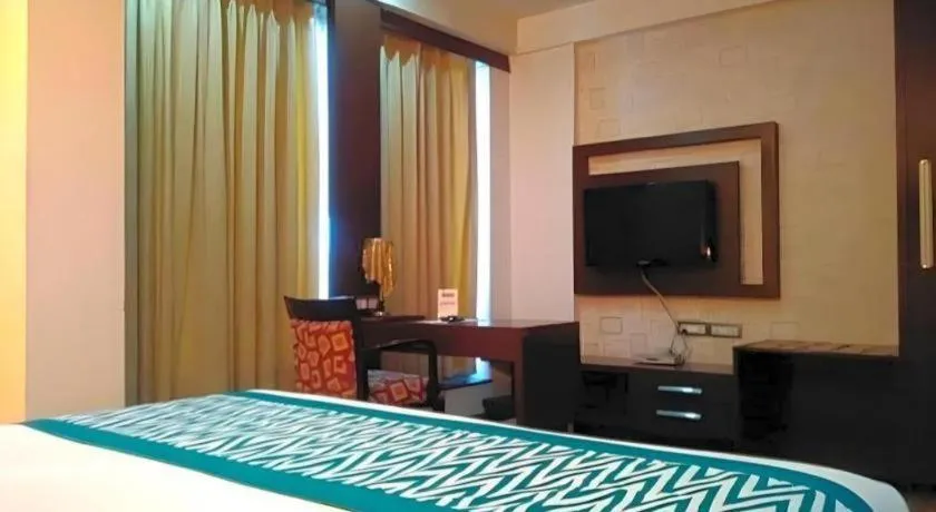 Bed in Hotel Signature Grand