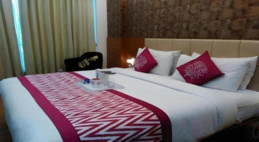 Bed in Hotel Signature Grand