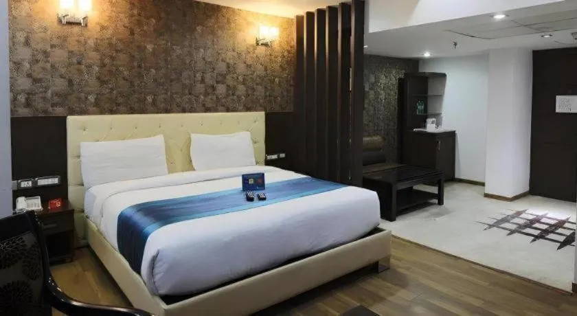 Bed in Hotel Signature Grand