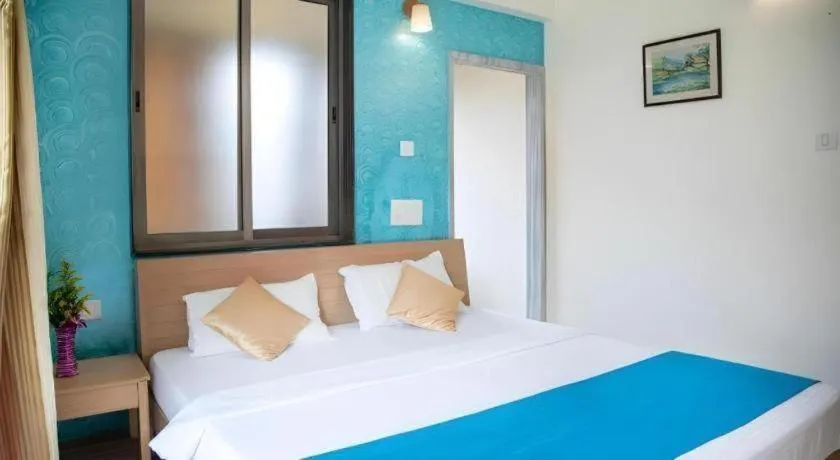 Bed in Palm Air by Goa Signature Stays